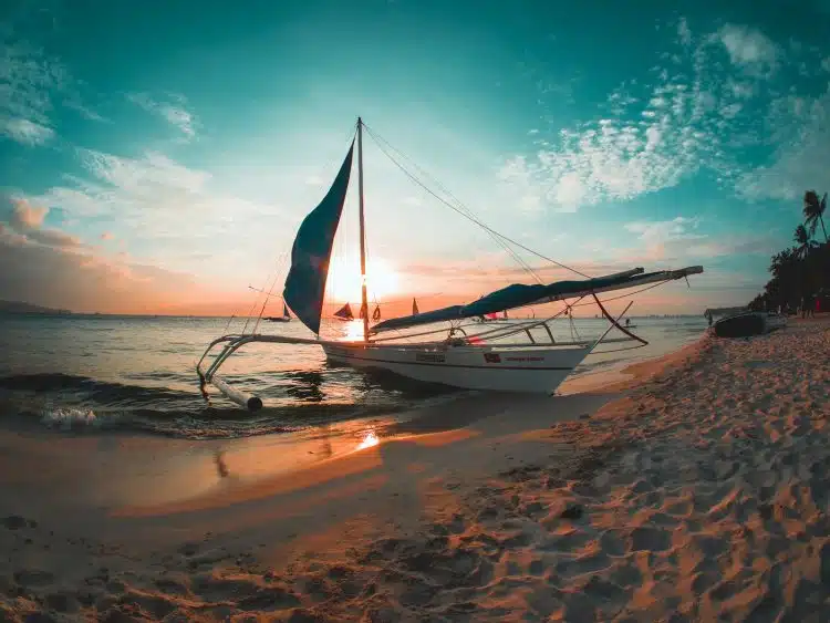 white boat docked on seashore