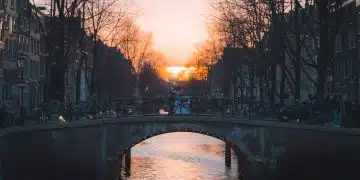 bridge over river during sunset