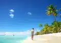 Carefree young woman relaxing on tropical beach