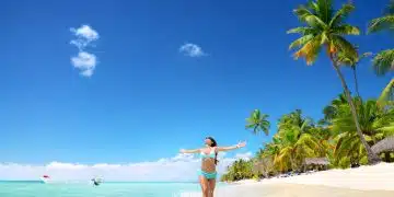 Carefree young woman relaxing on tropical beach